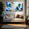 Biophilic living room decor featuring a large green abstract canvas art piece in a natural oak frame next to a large indoor plant.