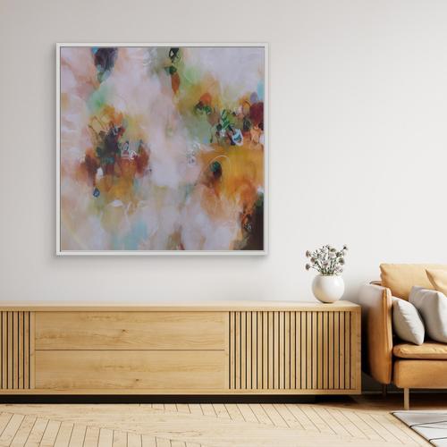 Modern living room with a colorful abstract painting on the wall, wooden sideboard, and beige sofa.