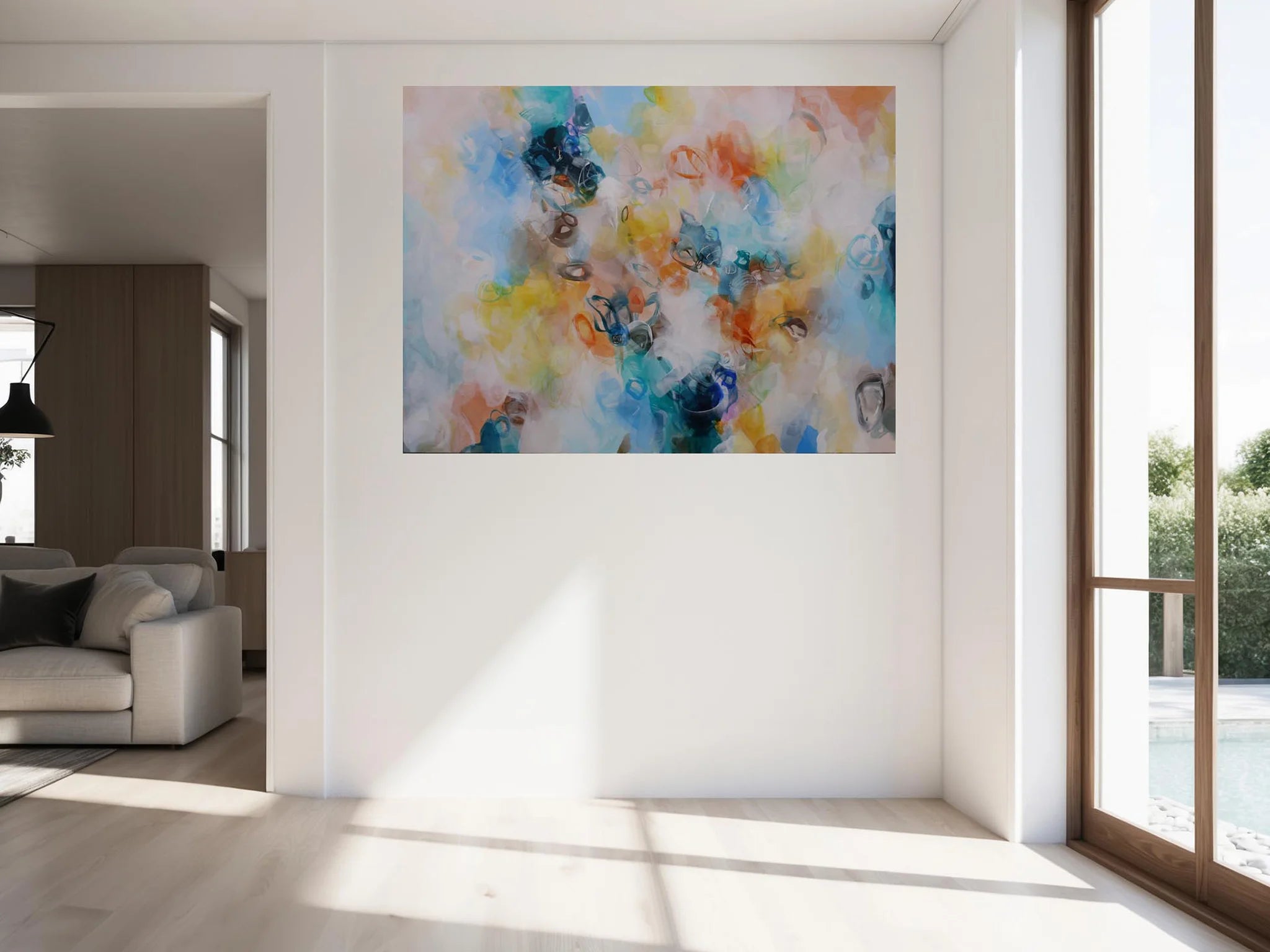 Abstract painting on a wall in a bright living room