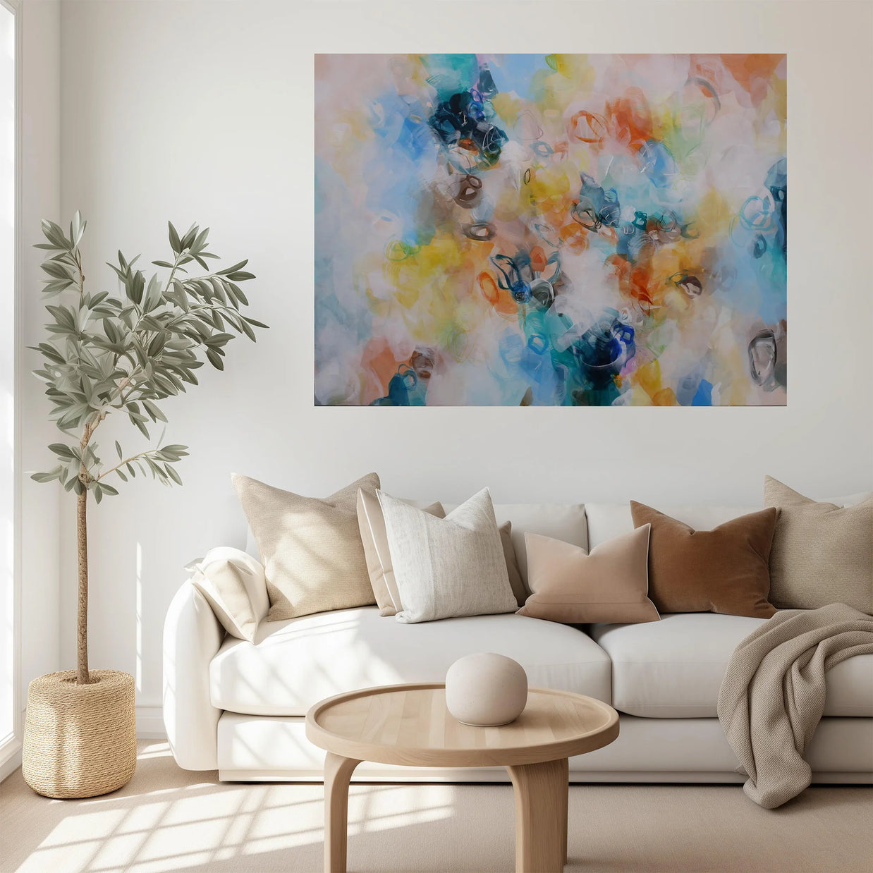 Living room with a white sofa, colorful abstract painting, and a small plant.