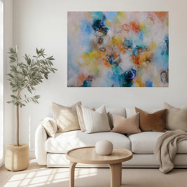 Living room with a white sofa, colorful abstract painting, and a small plant.