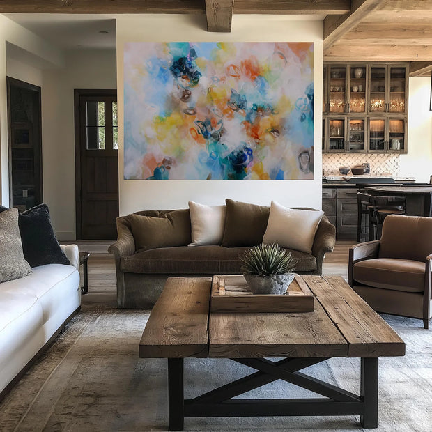Modern living room with a brown sofa, white walls, and a colorful abstract painting.