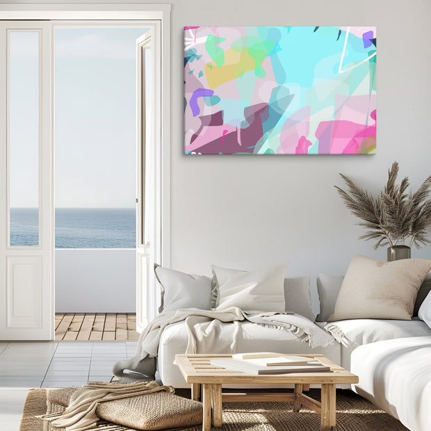 Living room with a colorful abstract painting on the wall, a sofa, and a view of the ocean.
