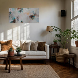 Living room with a white sofa, wooden coffee table, and decorative elements.