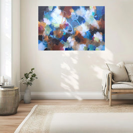 Abstract painting on a wall in a living room setting
