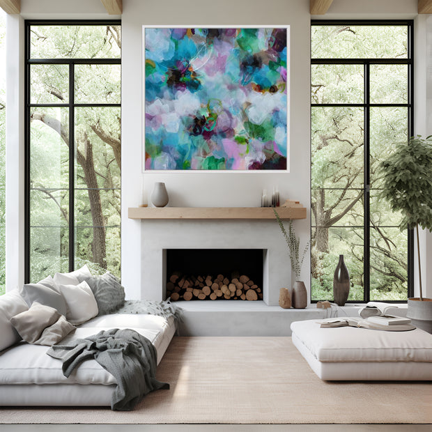 Modern living room with a fireplace, colorful abstract painting, and large windows.