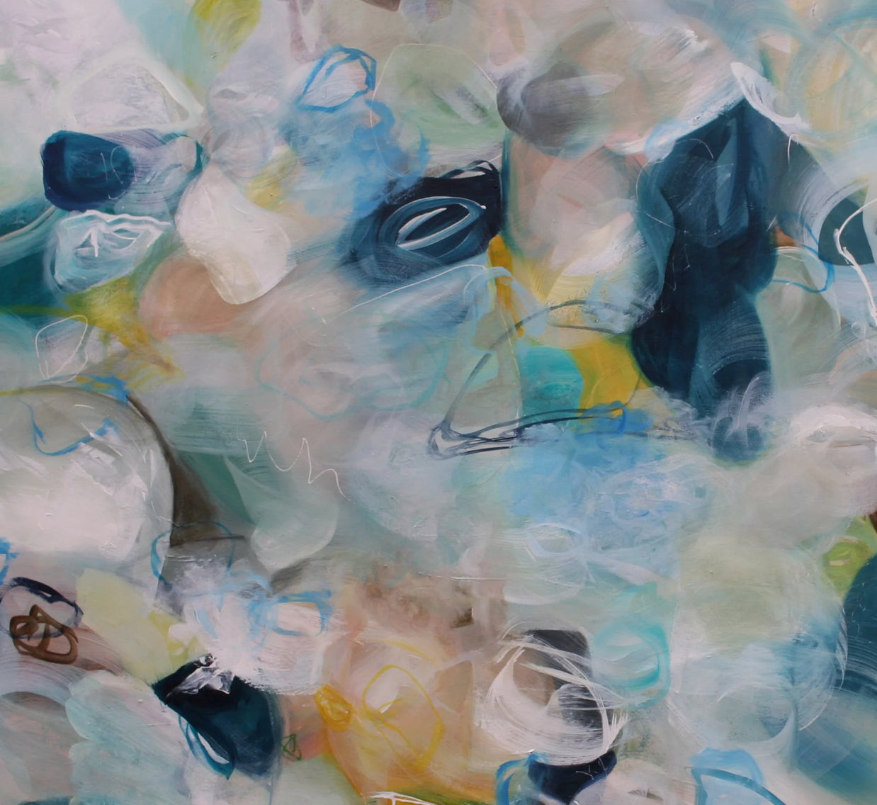 Abstract artwork with a mix of blue, green, and white colors.