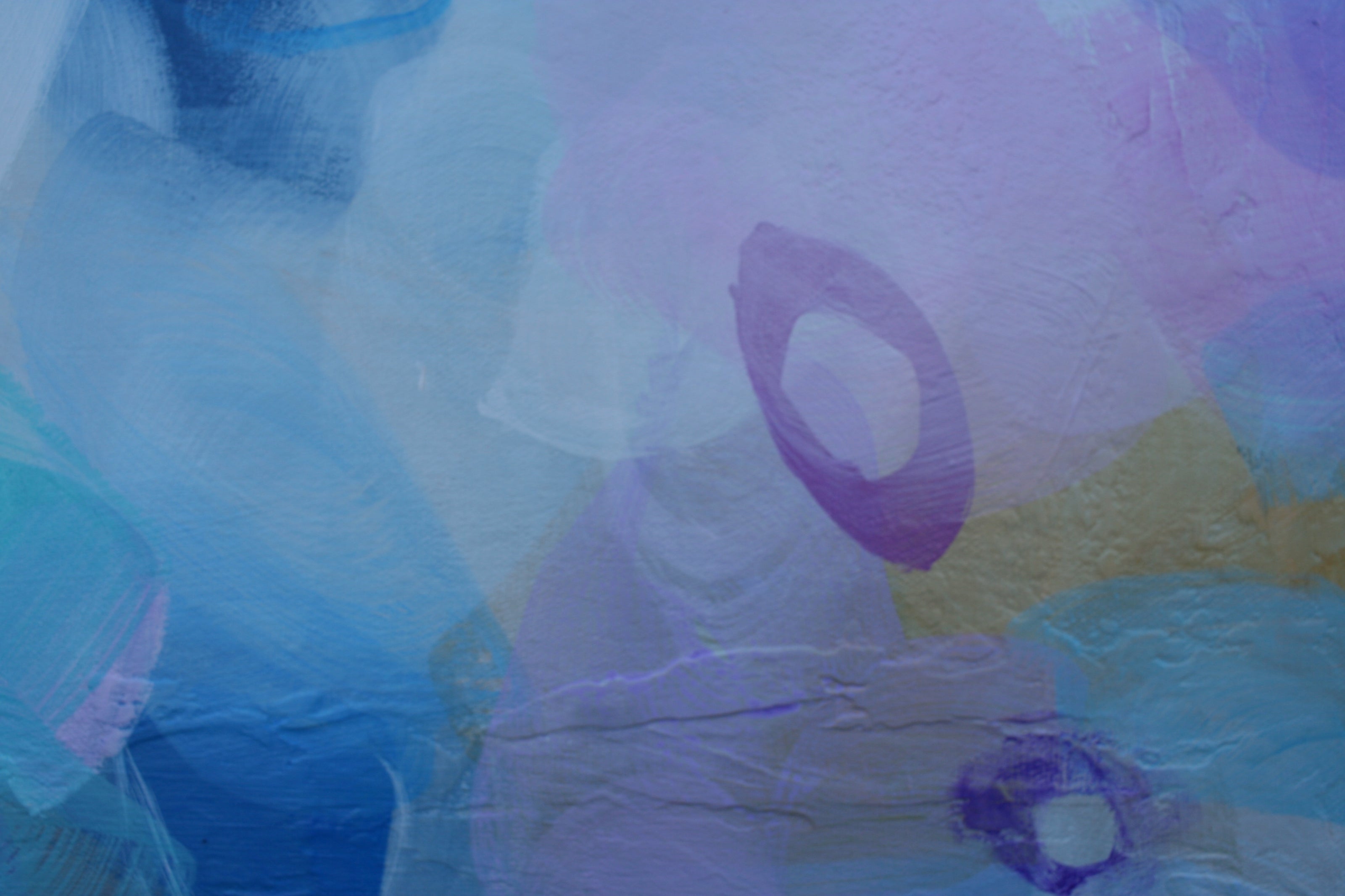 Abstract art with colorful shapes and patterns on a textured surface