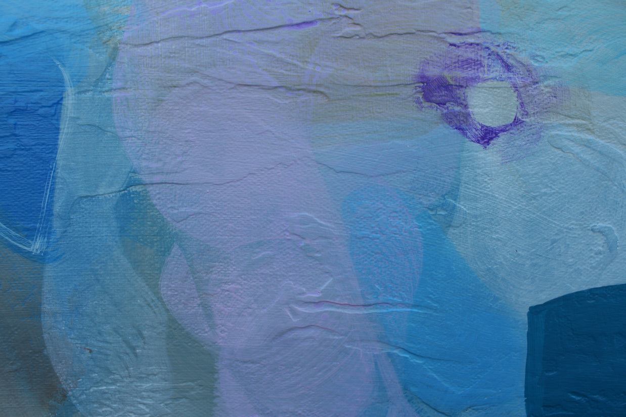Abstract art with blue and purple hues on a textured surface