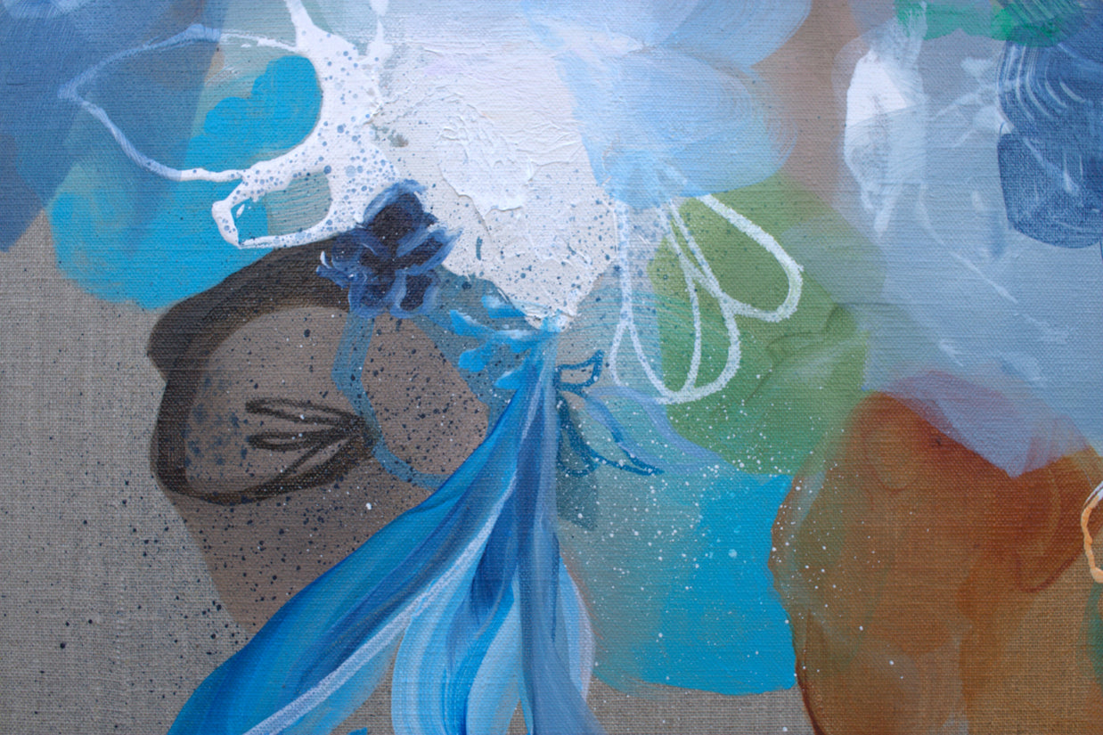 Abstract artwork with blue and green colors on a textured surface