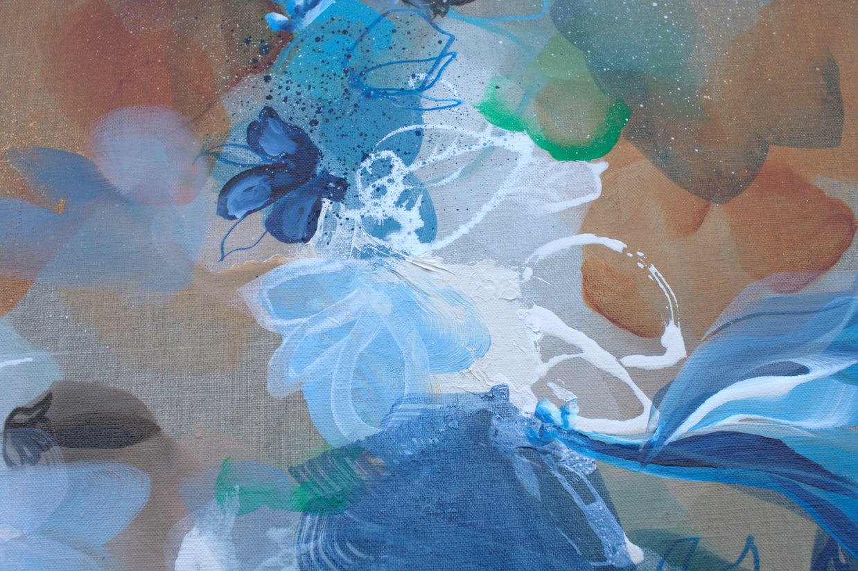 Abstract artwork with blue and white butterfly-like shapes on a textured background