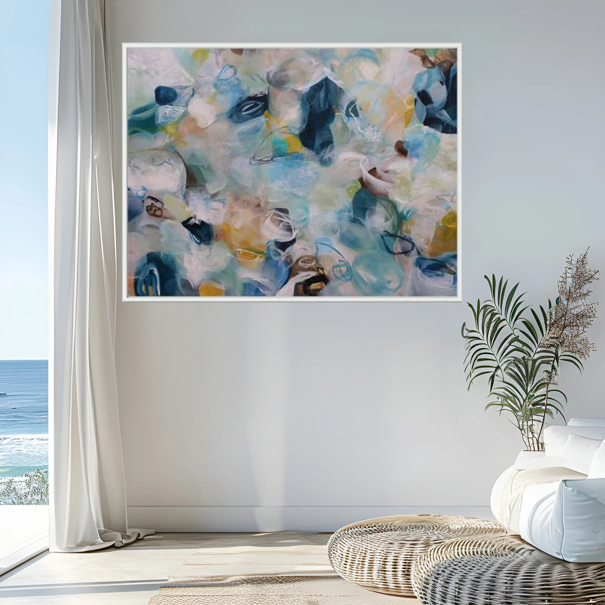 Abstract painting in a modern living room with a view of the ocean.