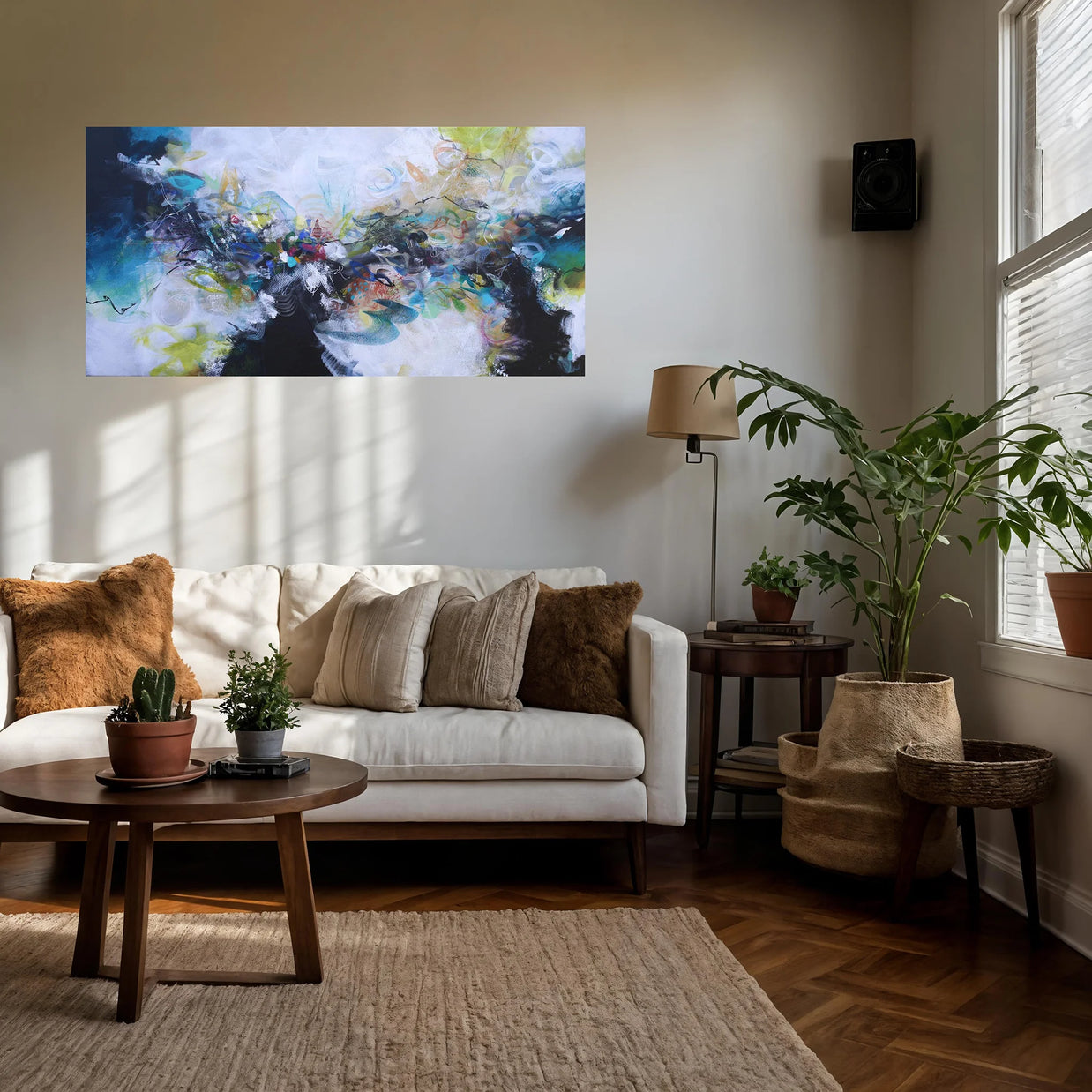 Living room with a white sofa, coffee table, and abstract painting on the wall.