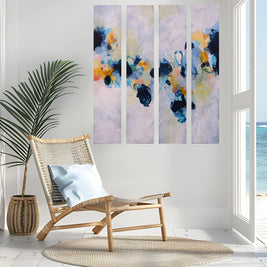 Colourful blue yellow white and greay four panel abstract painting next to chair
