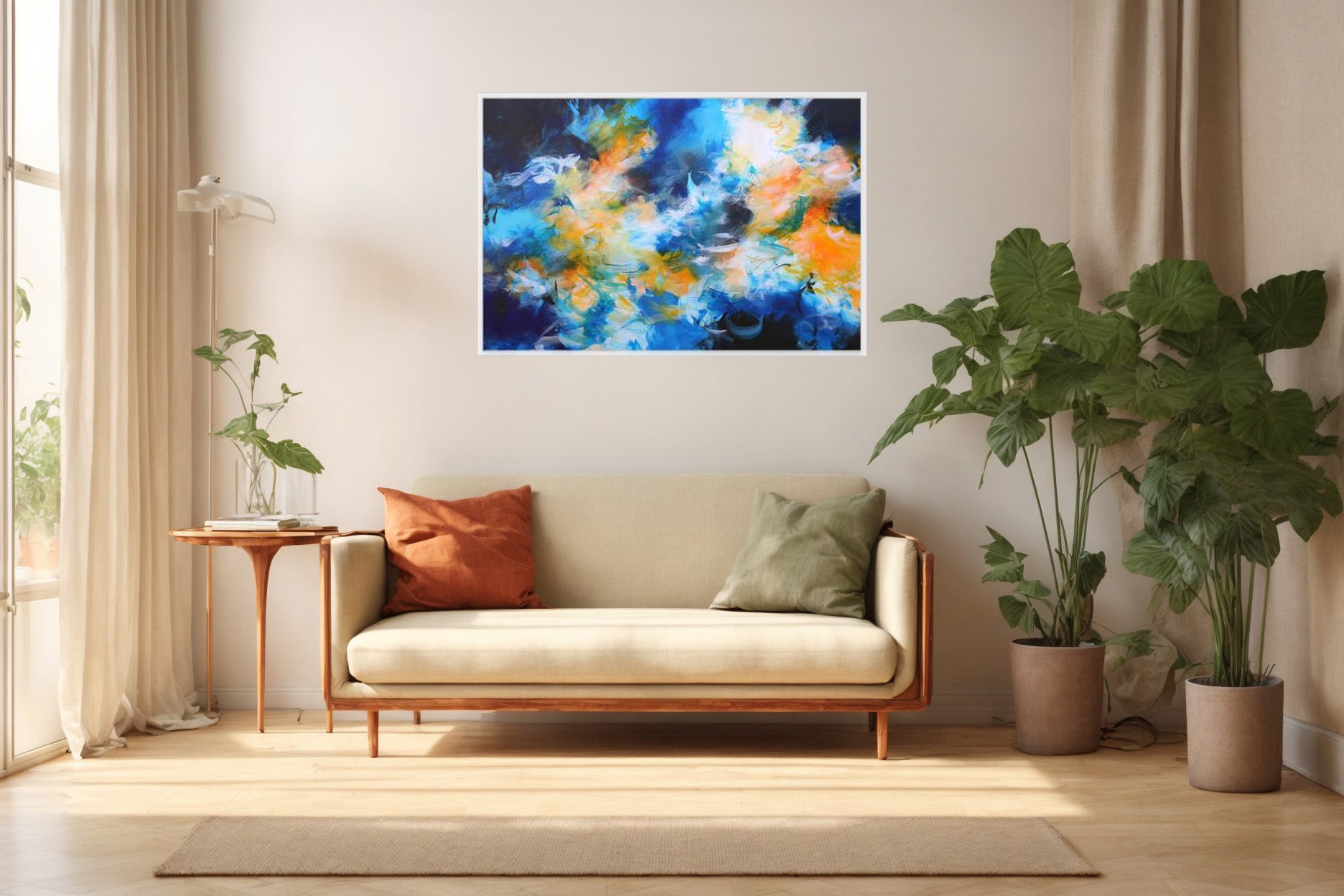 Blue orange and white framed abstract canvas print above sofa in lounge with large leafy plant