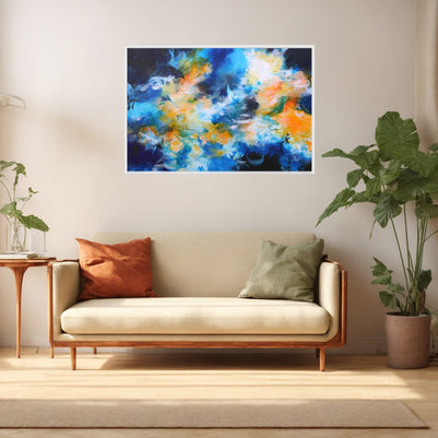 Blue orange and white framed abstract canvas print above sofa in lounge with large leafy plant