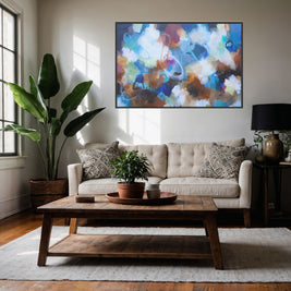 Living room with a beige sofa, wooden coffee table, and abstract painting on the wall.