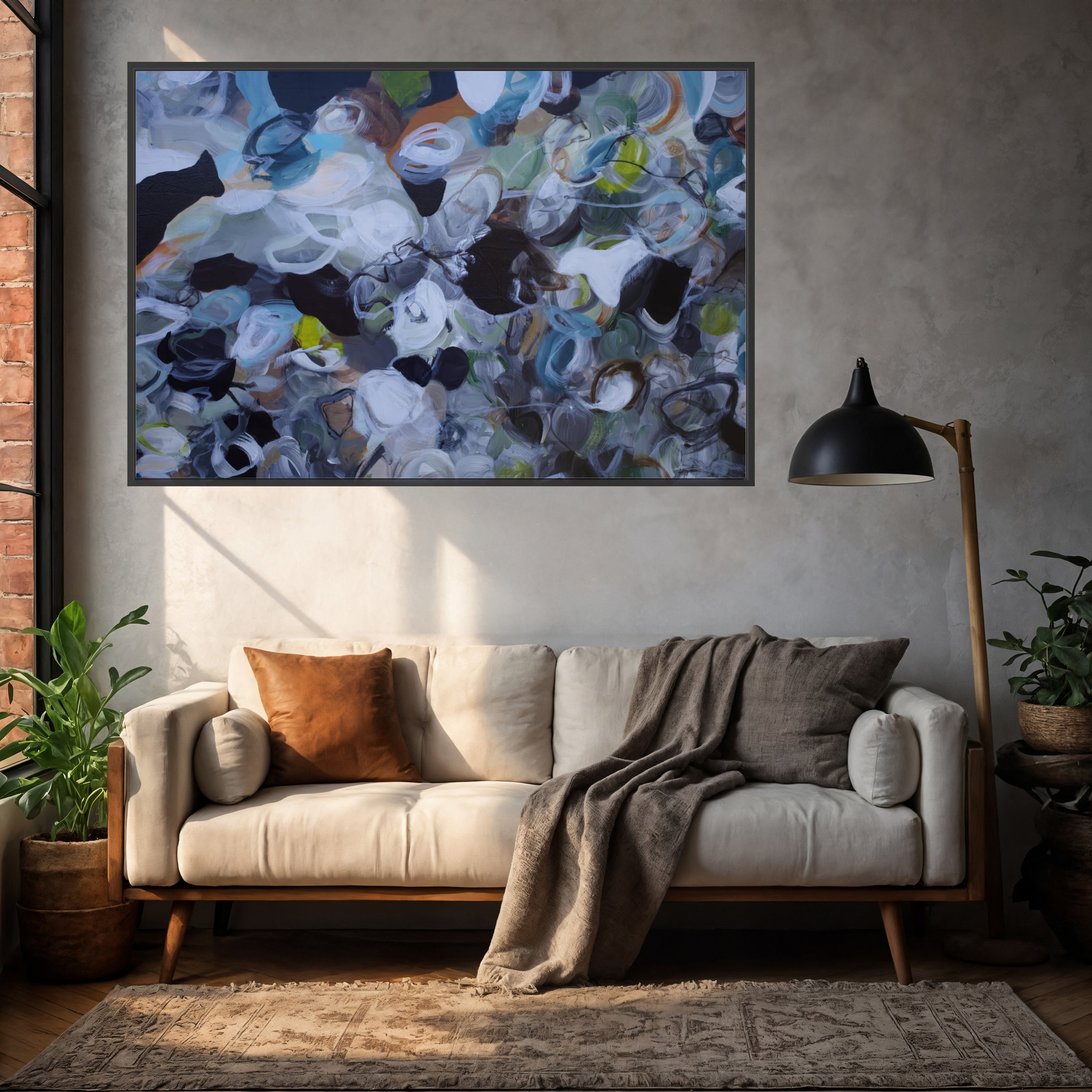 Living room with a beige sofa, abstract painting on the wall, and a lamp.