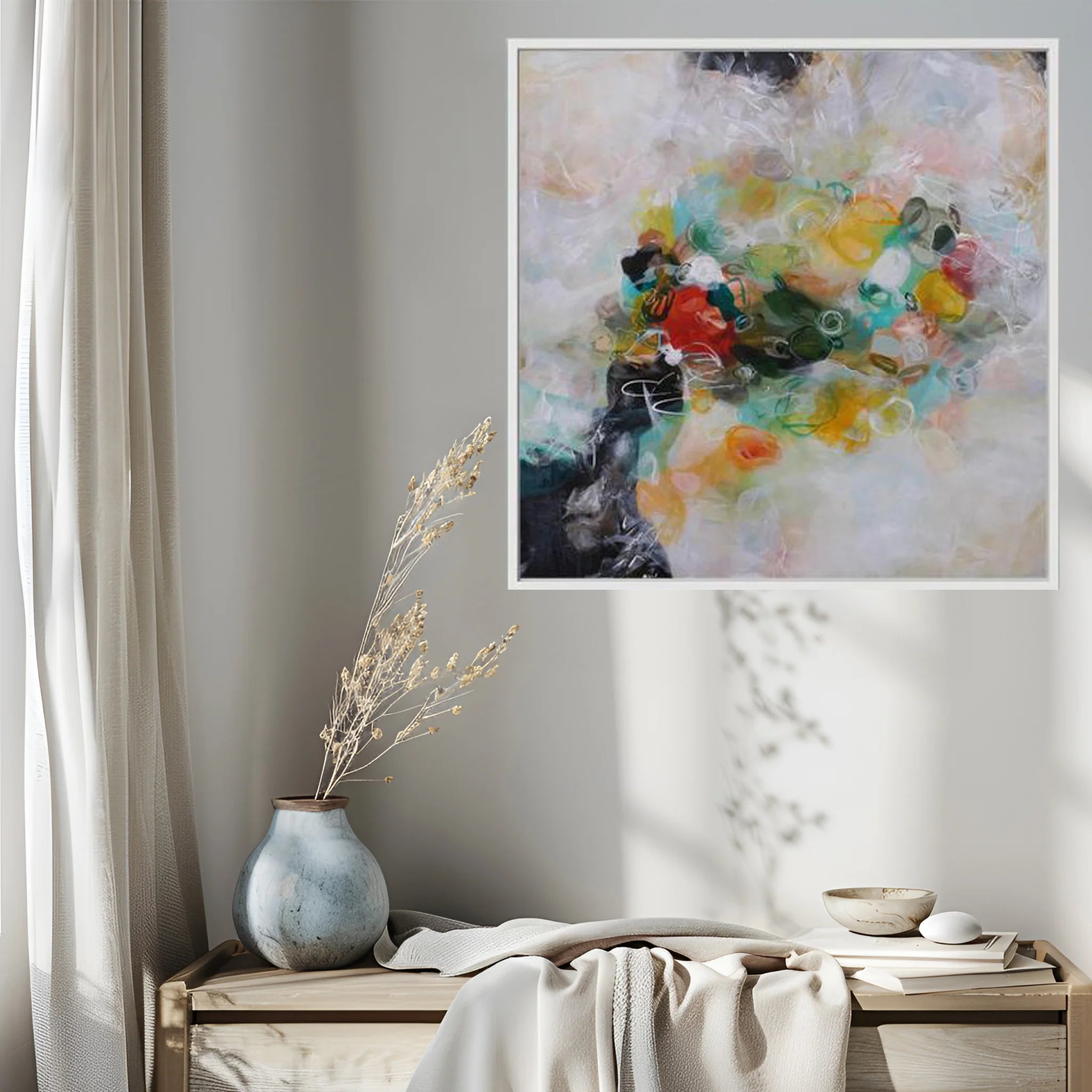 Abstract painting on a wall above a wooden bench with decor items.