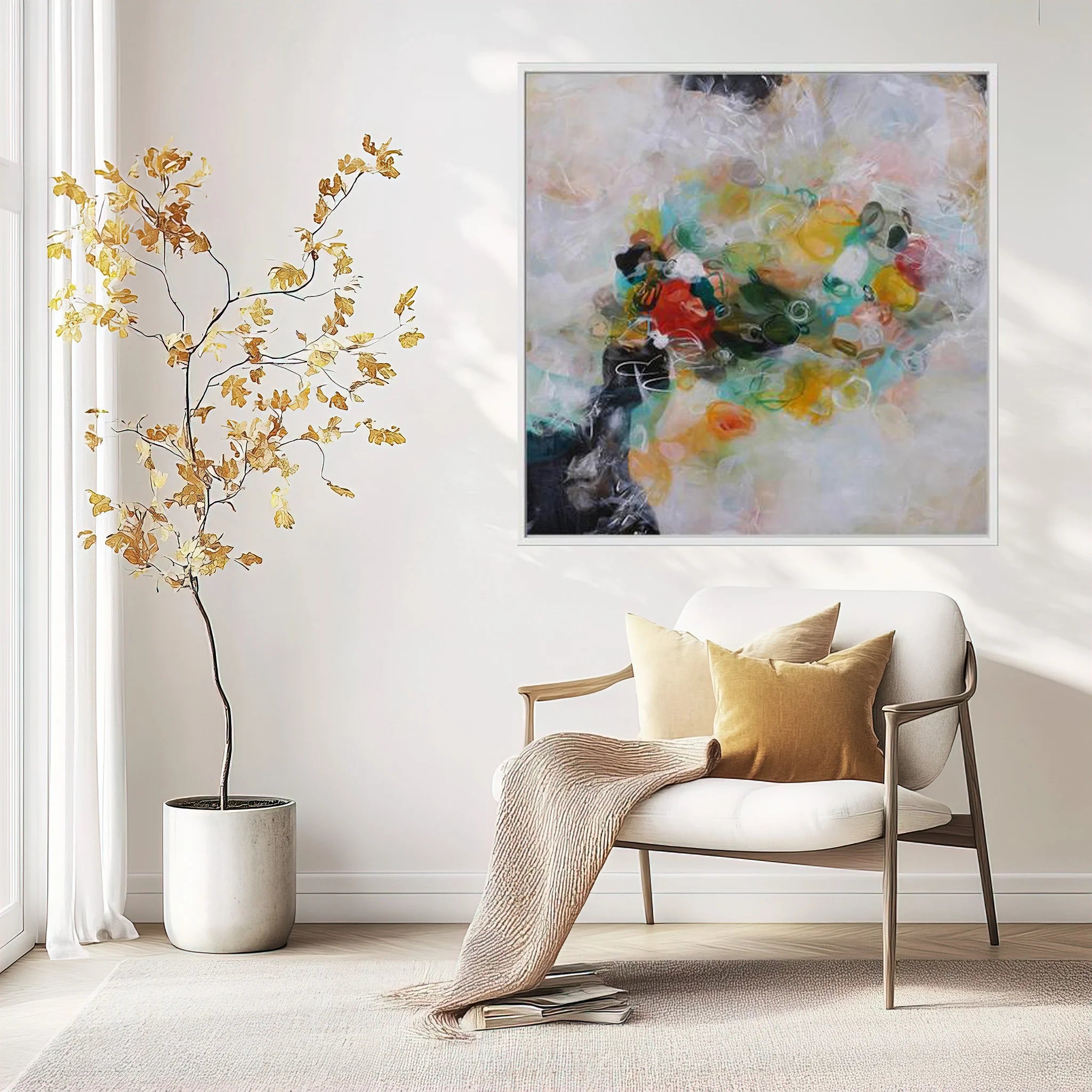 Modern living room with a white armchair, abstract painting, and decorative plant.