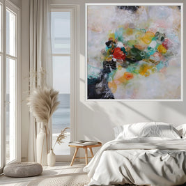 Modern bedroom with abstract art on the wall, large windows, and decorative elements.