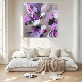 Floral abstract painting above a bed in a bedroom
