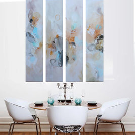 Dining room with a set of four abstract wall art pieces above a table.