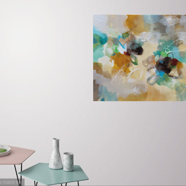 Abstract painting on a wall with decorative items on tables below.
