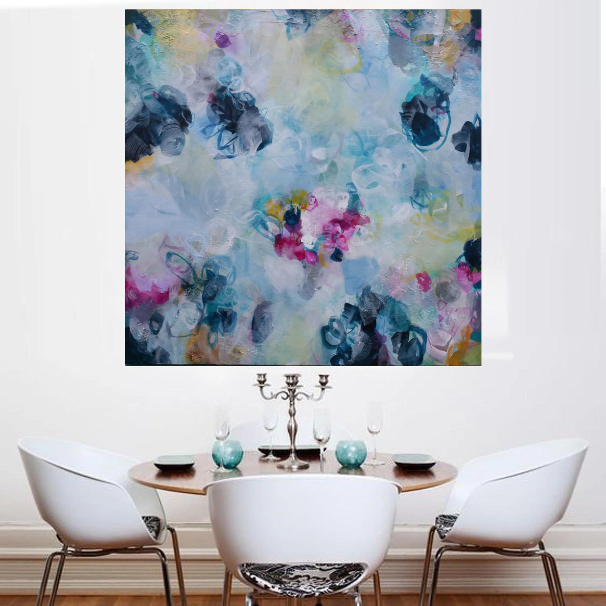 Dining room with a colorful abstract painting on the wall