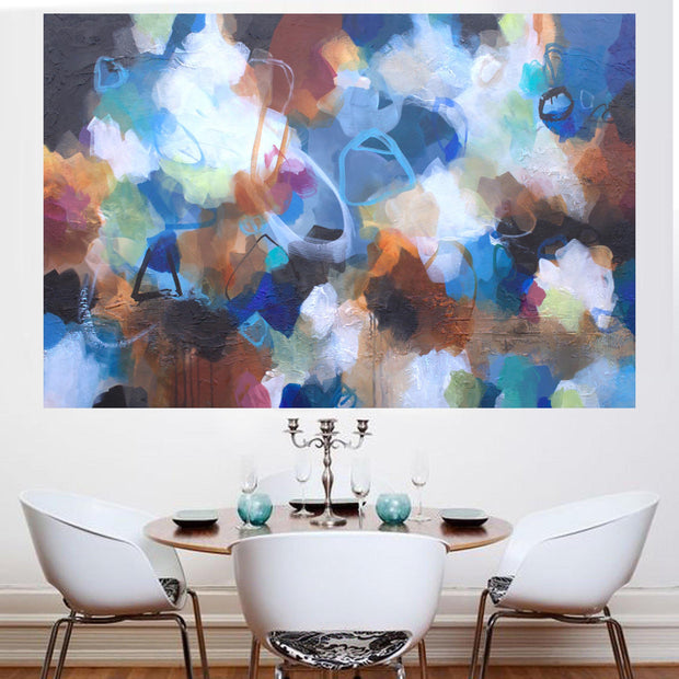 Dining room with a colorful abstract painting on the wall.