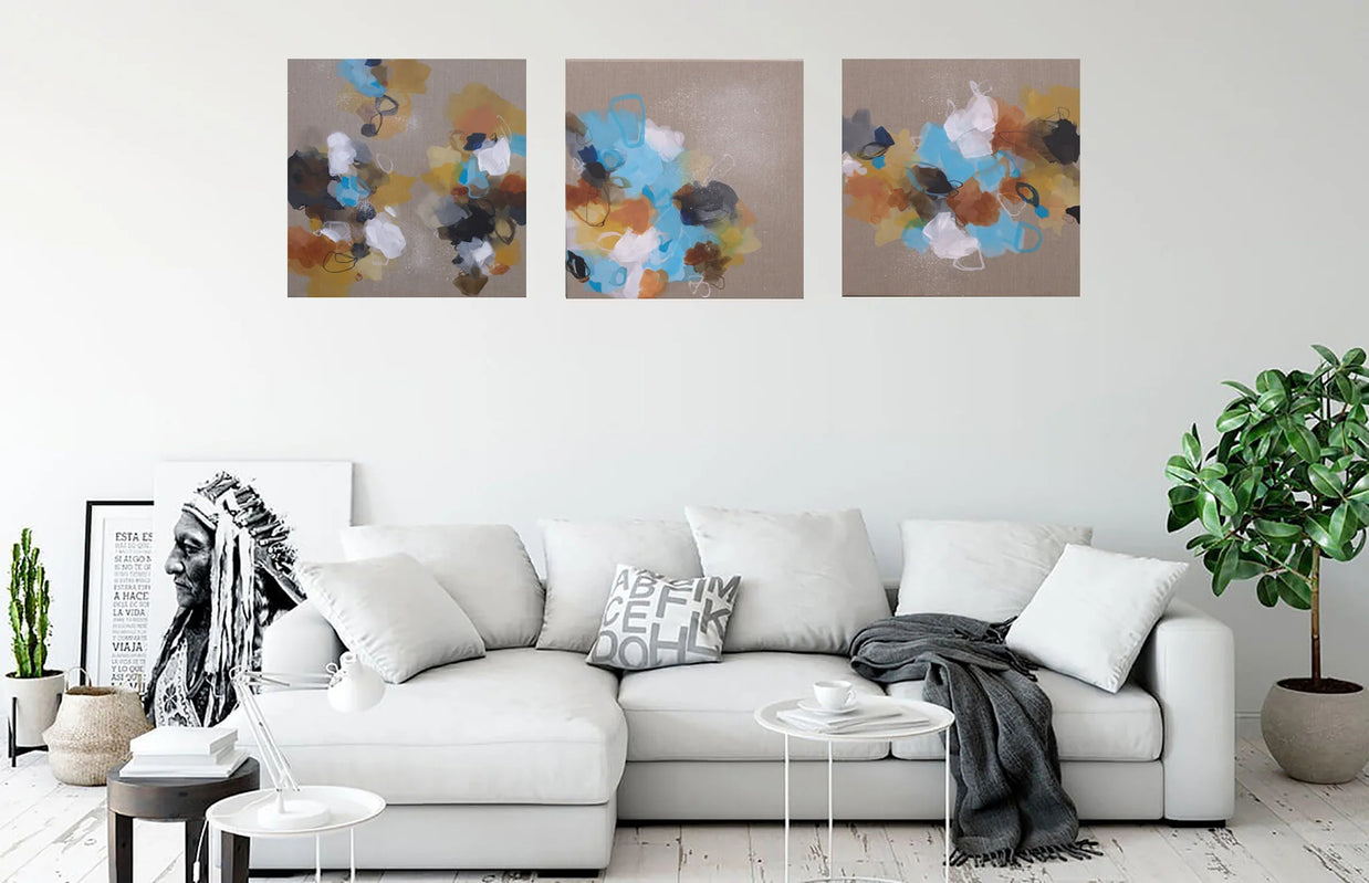 Three side-by-side images of colorful abstract art on a linen canvas background above sofa