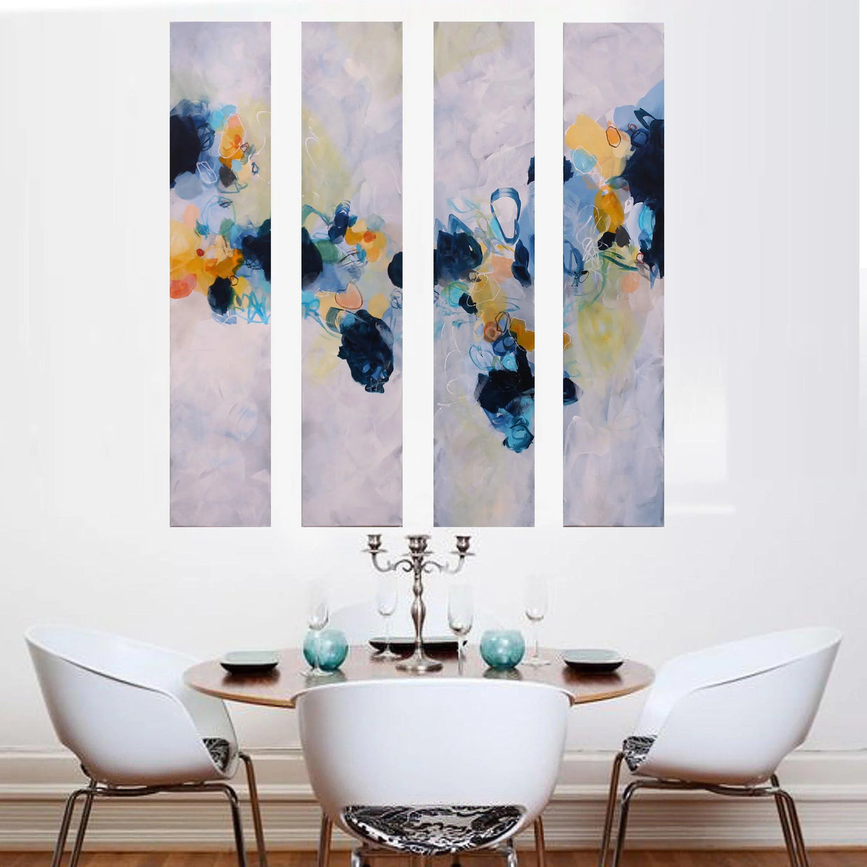 Colourful blue yellow white and greay four panel abstract painting above dining table and chairs