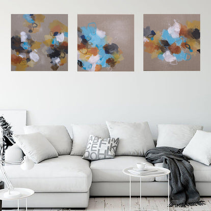 Living room with a white sofa, abstract wall art, and indoor plants.