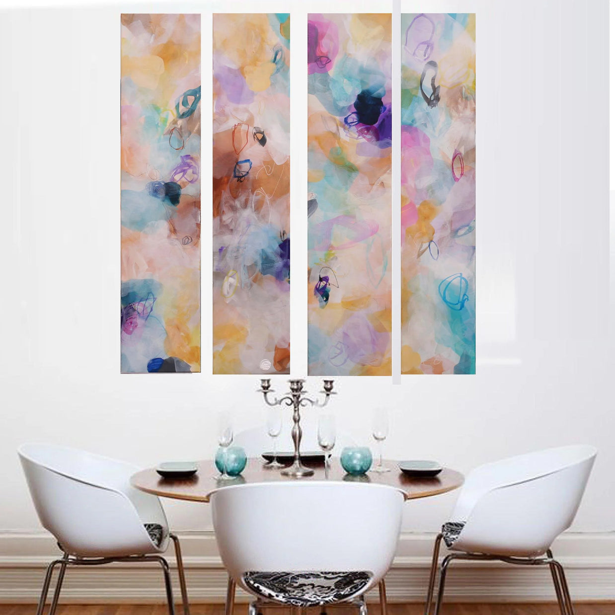 Colorful abstract wall art above a dining table with chairs.