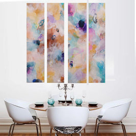 Colorful abstract wall art above a dining table with chairs.