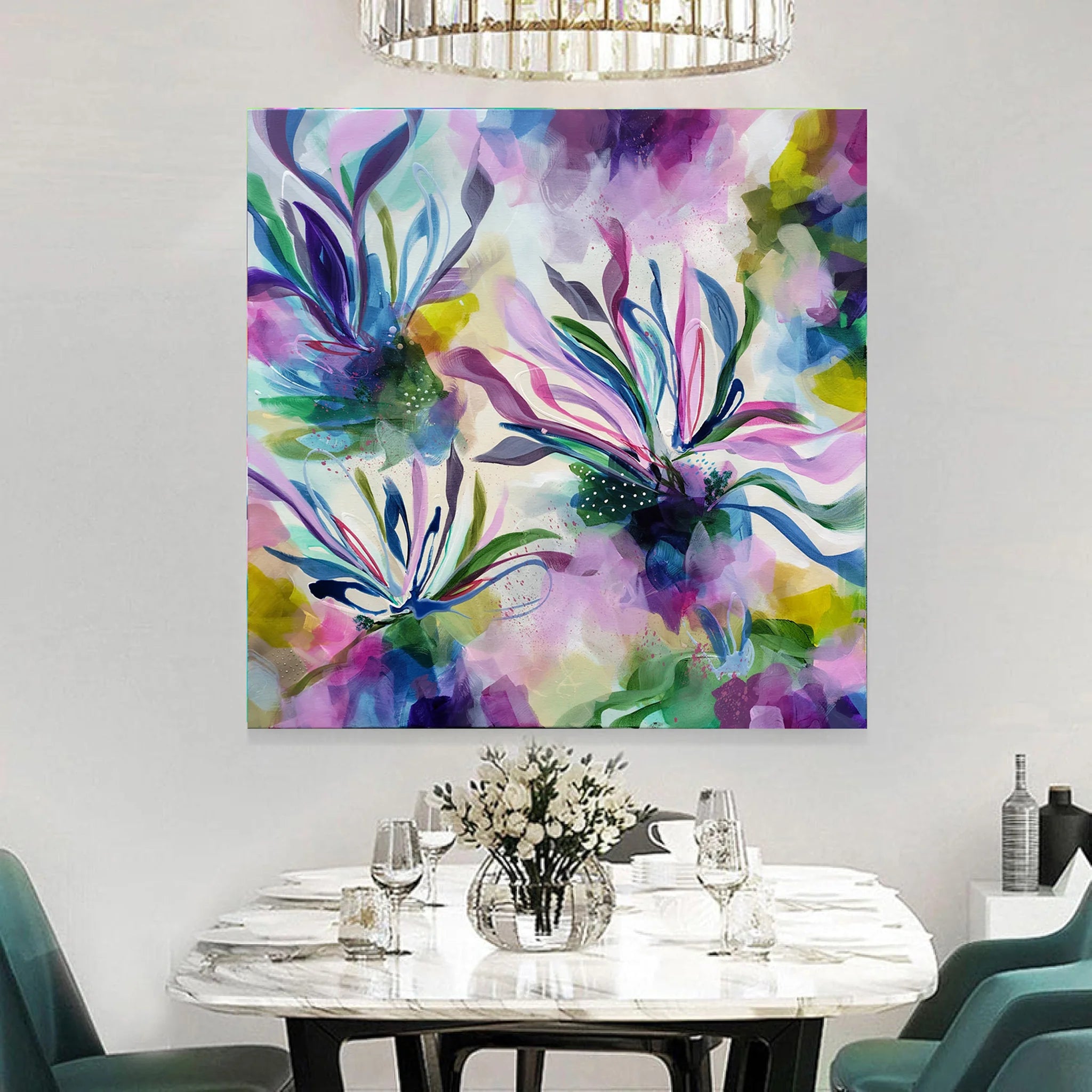Colorful abstract painting on a wall above a dining table with chairs.