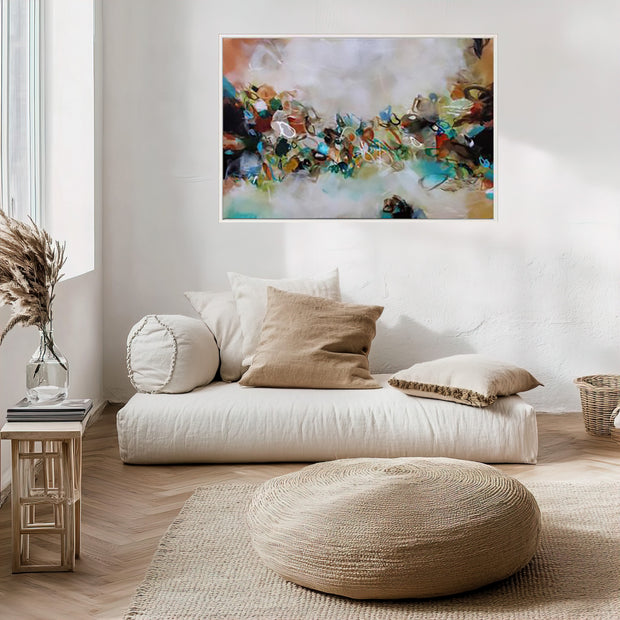 Modern living room with a white sofa, decorative pillows, and a colorful abstract painting on the wall.