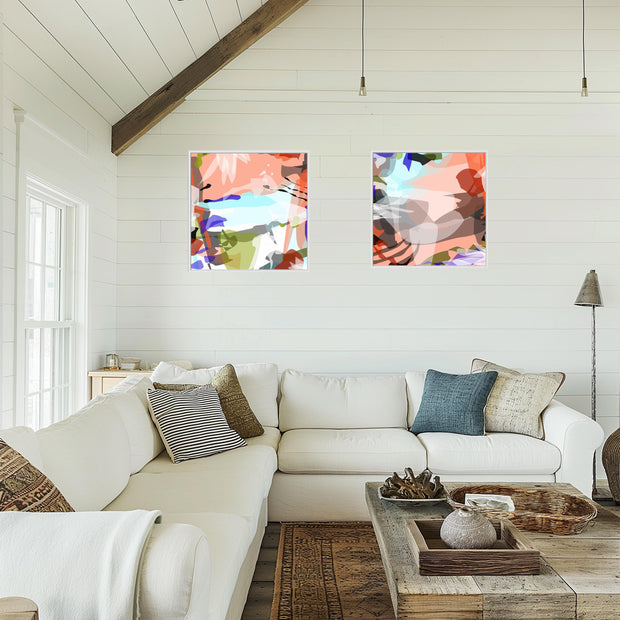 Living room with a white sofa, abstract art on the wall, and a wooden coffee table.