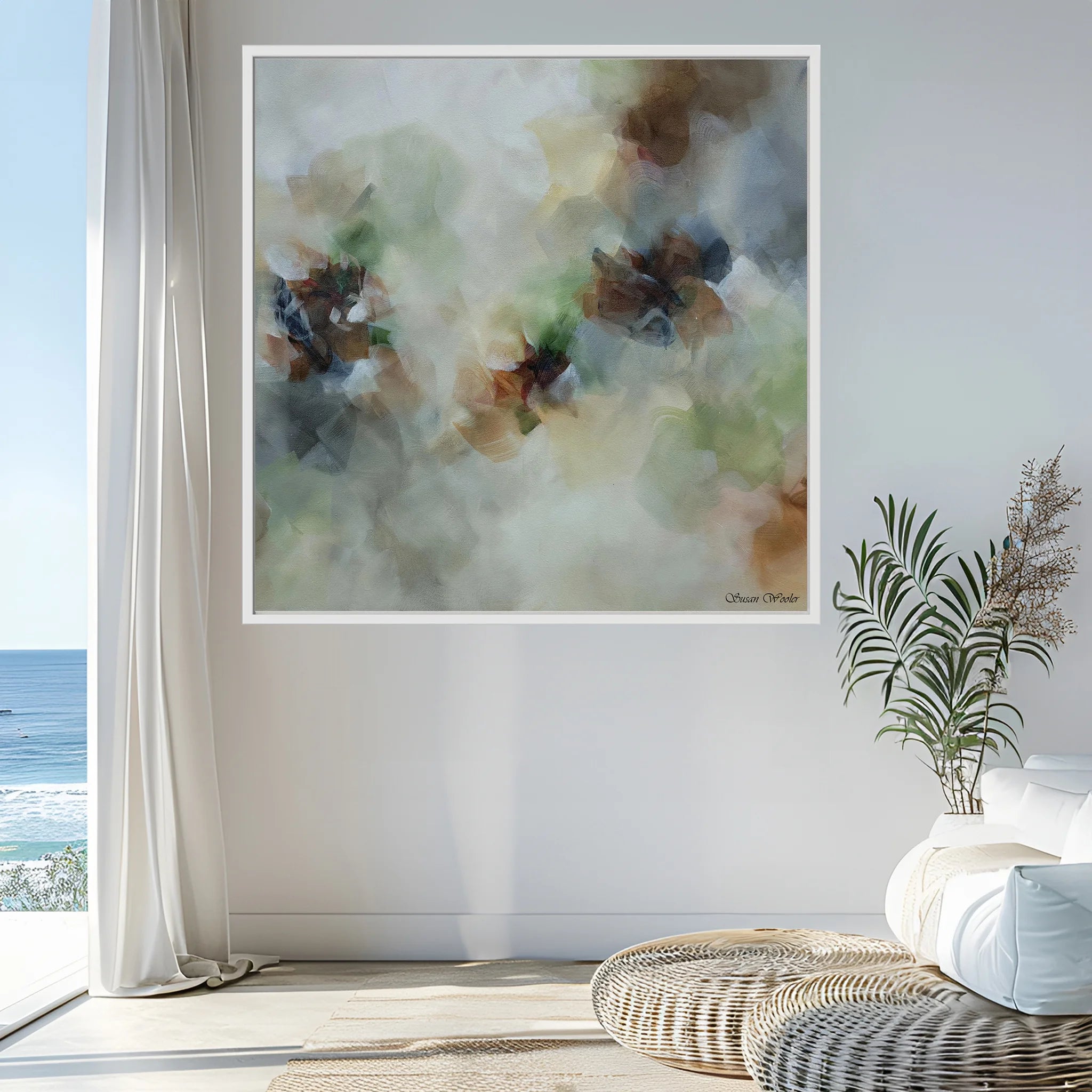 Framed abstract floral art on a wall with a coastal view