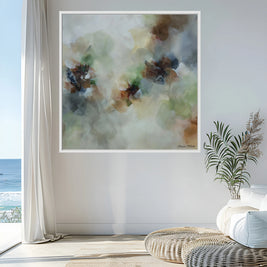 Framed abstract floral art on a wall with a coastal view