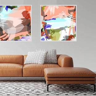 Brown leather sofa with patterned cushions in a room with abstract art on the wall.