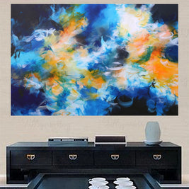 Abstract painting with blue, orange, and white colors on a wall above a black entertainment console.