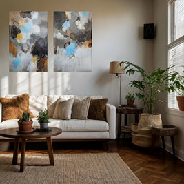 Living room with a white sofa, wooden coffee table, and abstract wall art.