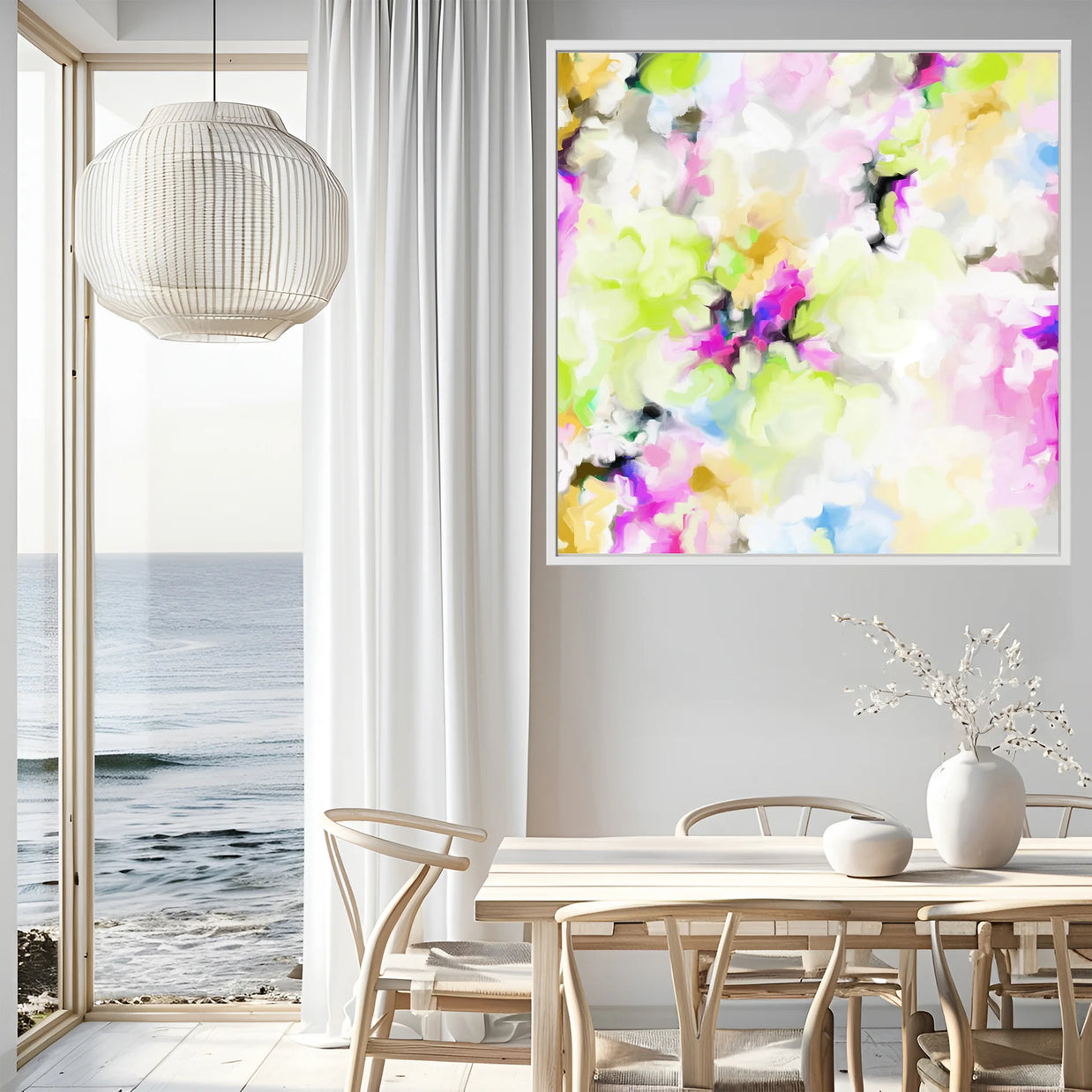 Modern interior with a colorful abstract painting on the wall, a dining table, and ocean view.