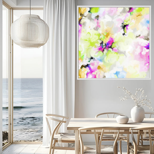 Modern interior with a colorful abstract painting on the wall, a dining table, and ocean view.