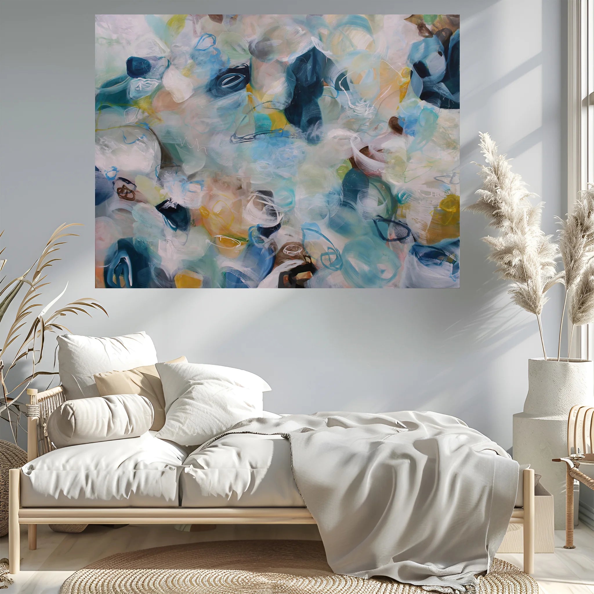 Abstract painting above a bed in a bedroom with decorative elements.