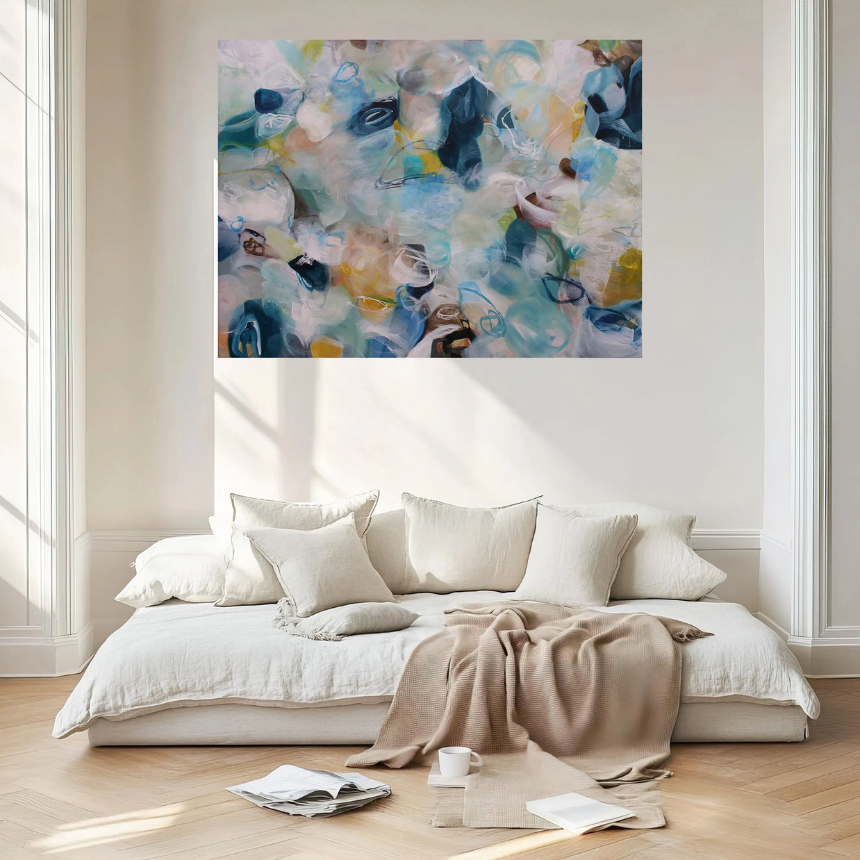 Modern bedroom with a large abstract painting above a bed.