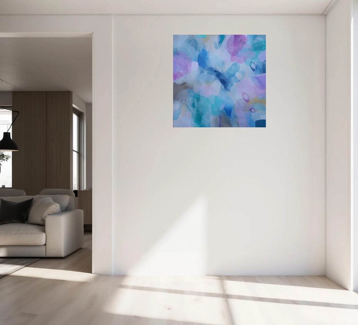 Abstract painting on a white wall in a modern living room