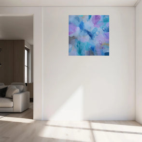 Abstract painting on a white wall in a modern living room