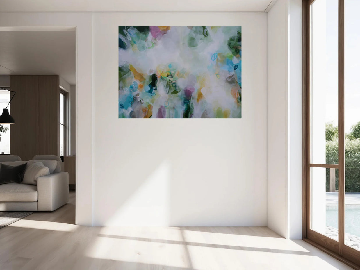 Abstract painting on a wall in a bright living room